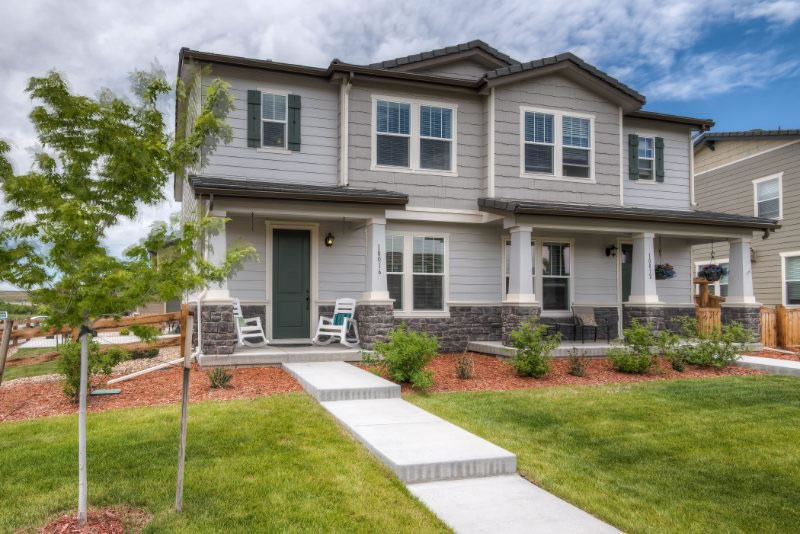 Modern two-story Utah home with a well-maintained roof and landscaped front yard.